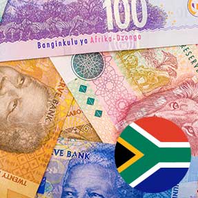 South African rand banknotes beside the national flag (official artwork)